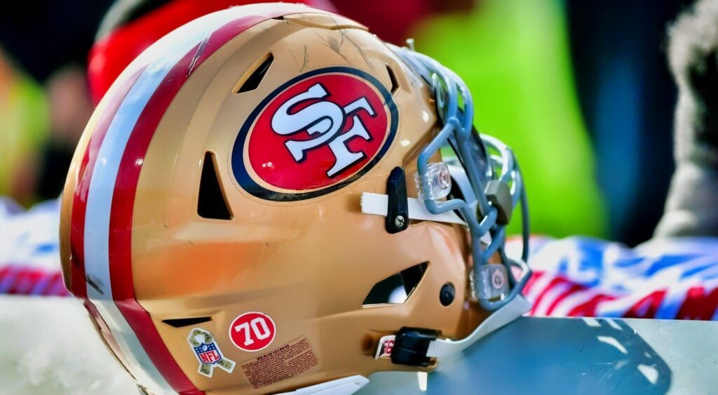 San Francisco 49ers helmet shown on sidelines.