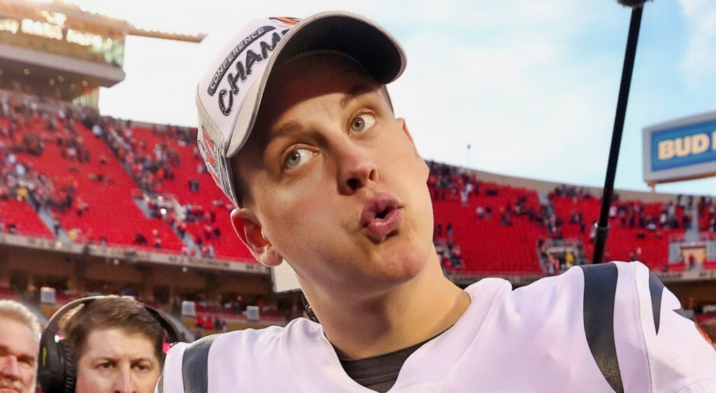 Joe Burrow makes a face while walking off the field after a game.