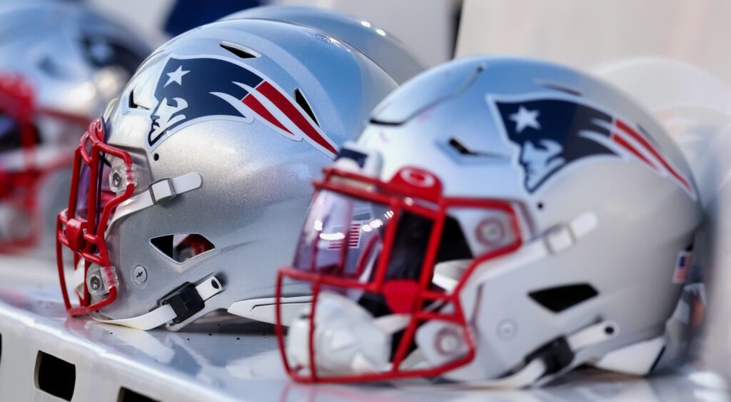 New England Patriots helmet shown on bench.