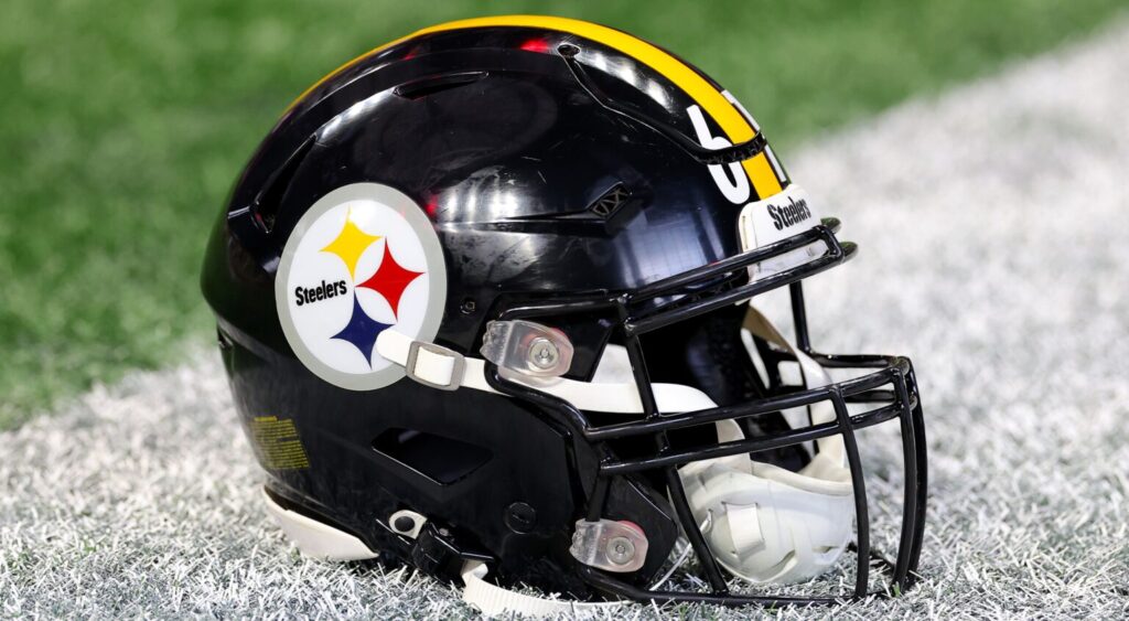 Pittsburgh Steelers helmet shown on ground.