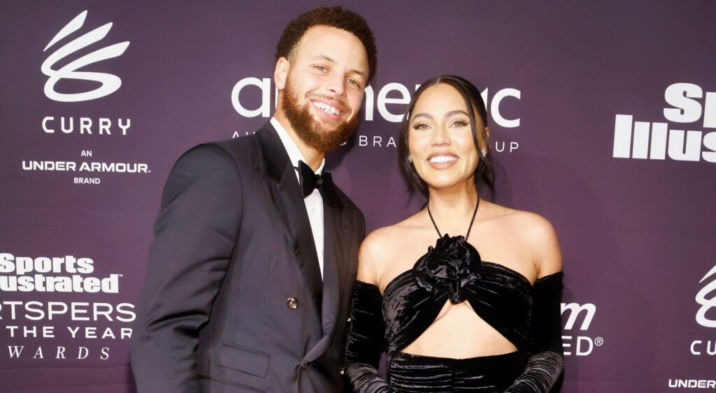 Stephen and Ayesha Curry posing at event