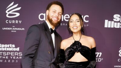 Stephen and Ayesha Curry posing at event