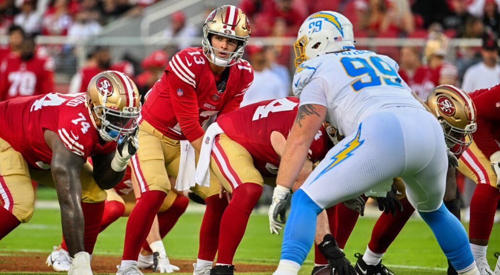 49ers and chargers players at line of scrimmage
