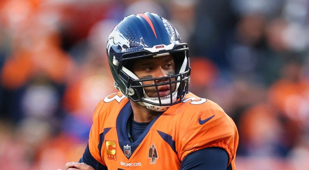 Russell Wilson of Denver Broncos looking on.