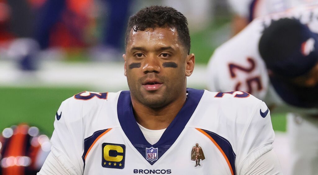 Russell Wilson of the Denver Broncos looking on.