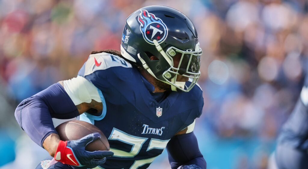 Derrick Henry of Tennessee Titans running with football.