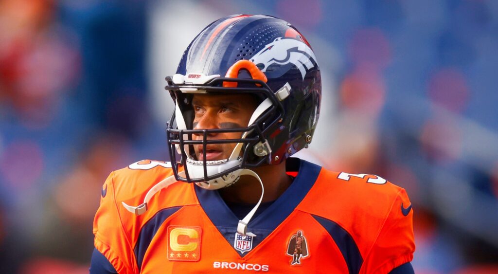 Russell Wilson of Denver Broncos looking on.