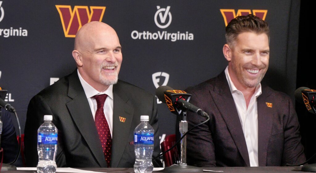 Dan Quinn (left) and Adam Peters (right) of Washington Commanders speaking at press conference.
