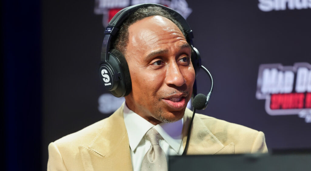 Stephen A. Smith speaking into headset