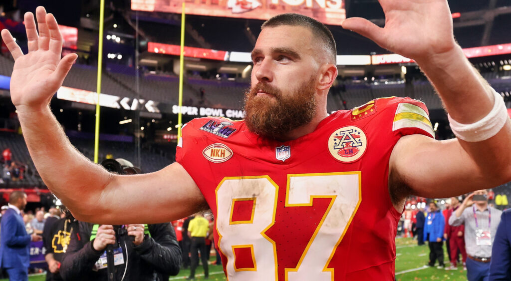 Travis Kelce with his hands in the air