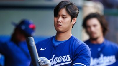Shohei Ohtani in dugout with bat