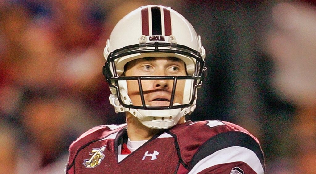 Former South Carolina quarterback Chris Smelley looks on.