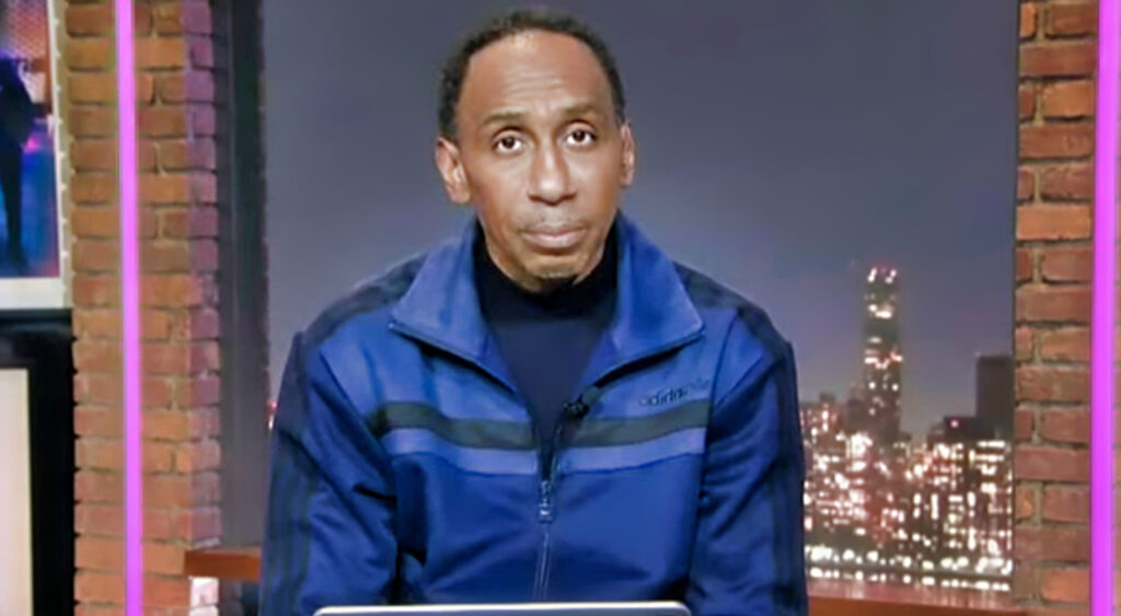 Stephen A. Smith wearing blue and black track suit
