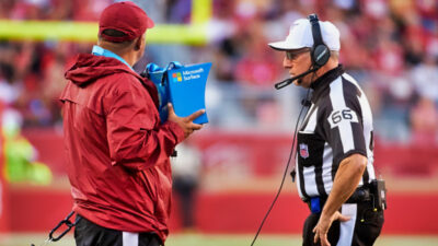 NFL referee engaged in replay review