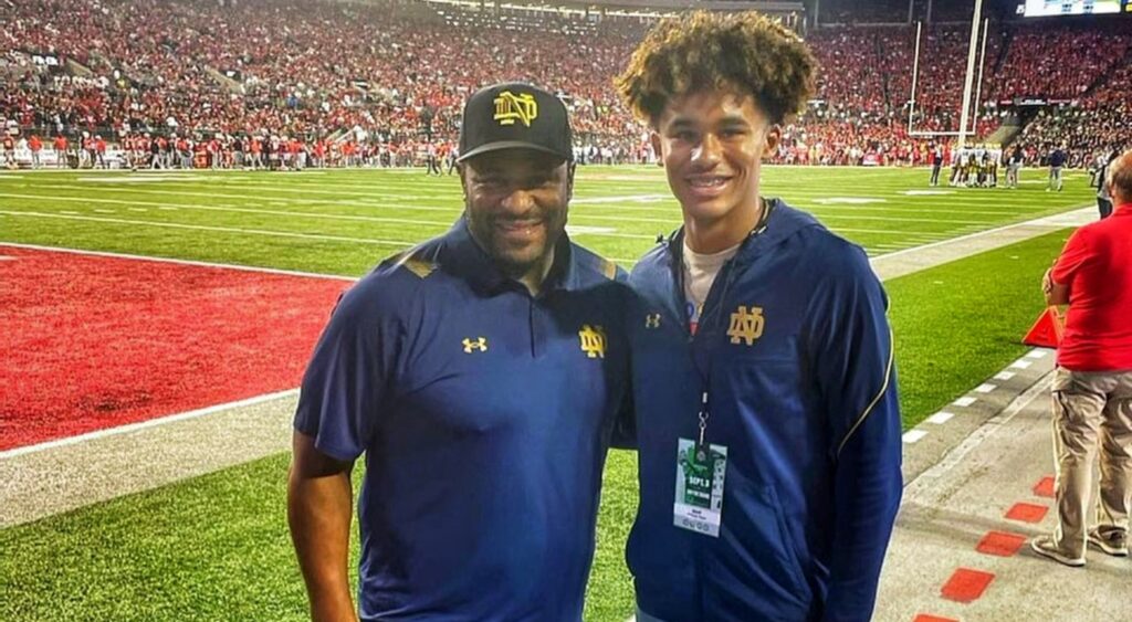 Jerome Bettis Jr. and his dad posing at game