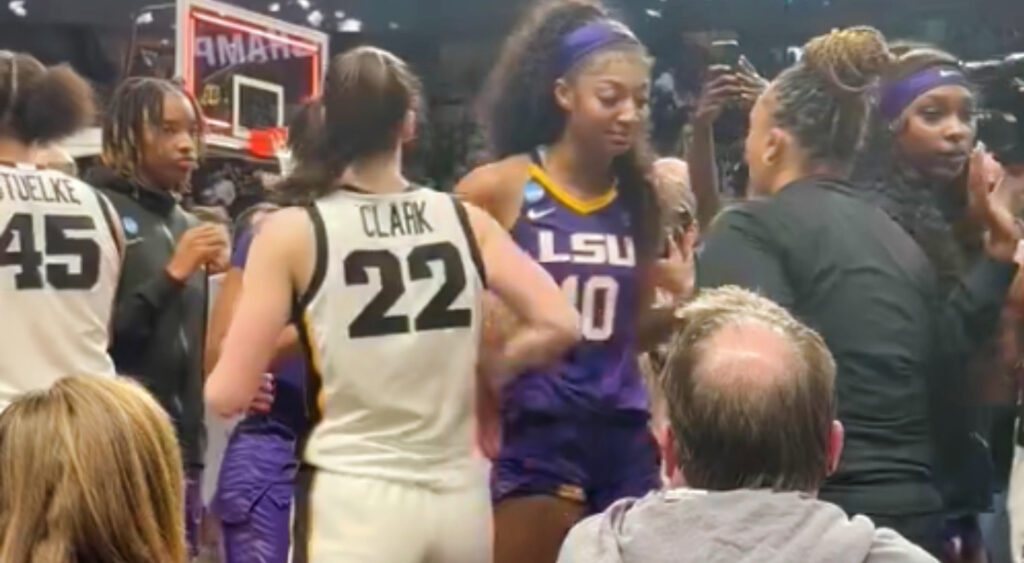 Caitling Clark standing next to Angel Reese