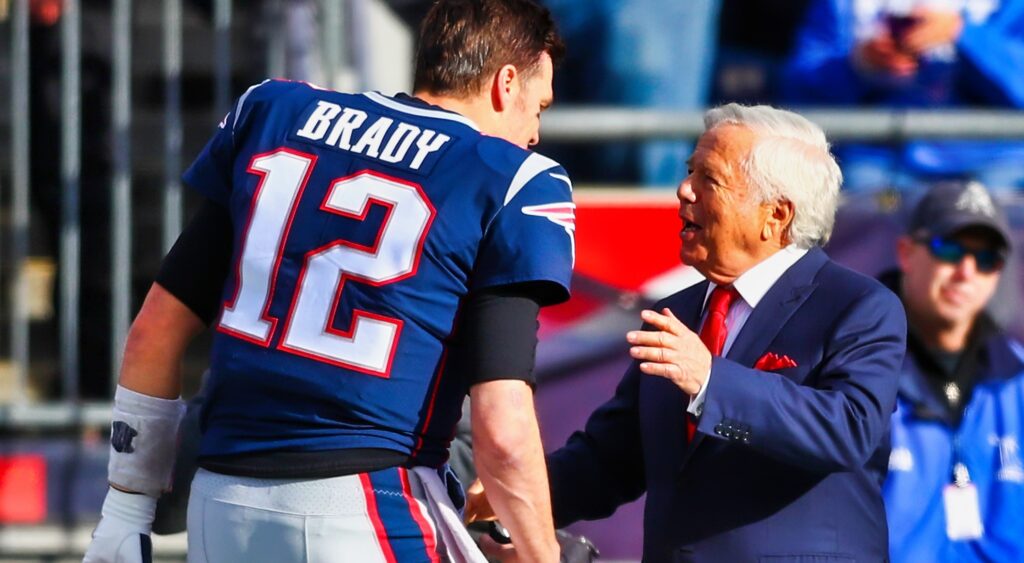 Tom Brady shakes New England Patriots owner Robert Kraft's hand.