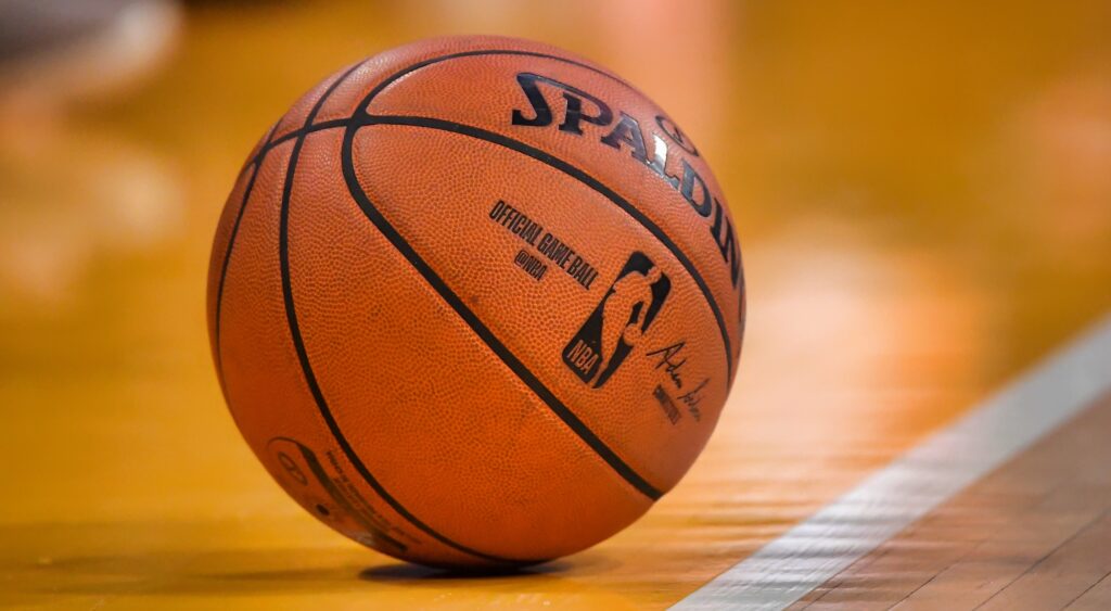 An NBA basketball on the court.