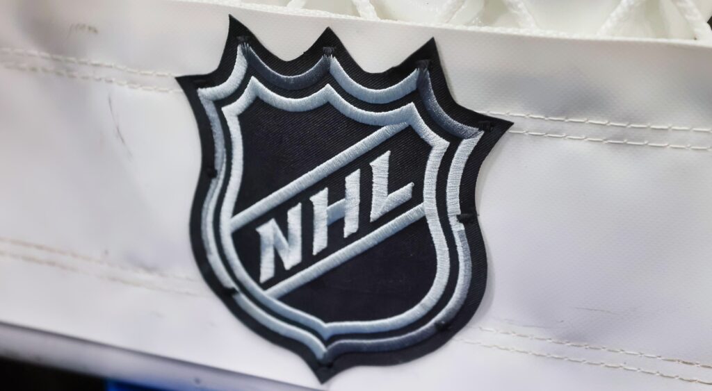 NHL logo shown on net. The Arizona Coyotes could reportedly move to Salt Lake City.
