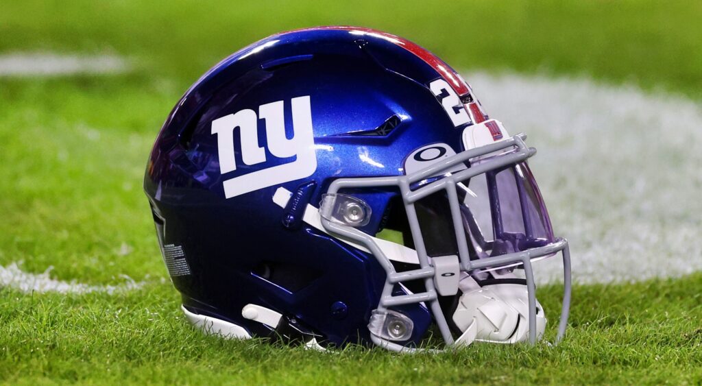 New York Giants helmet shown on field.