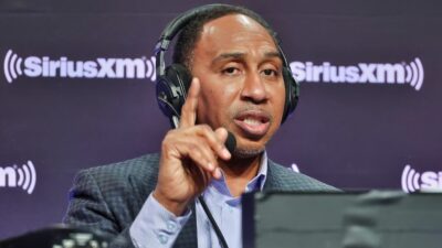 Stephen A Smith conducting interview with headset on