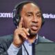 Stephen A Smith conducting interview with headset on