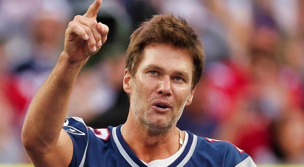 Tom Brady points to the sky.