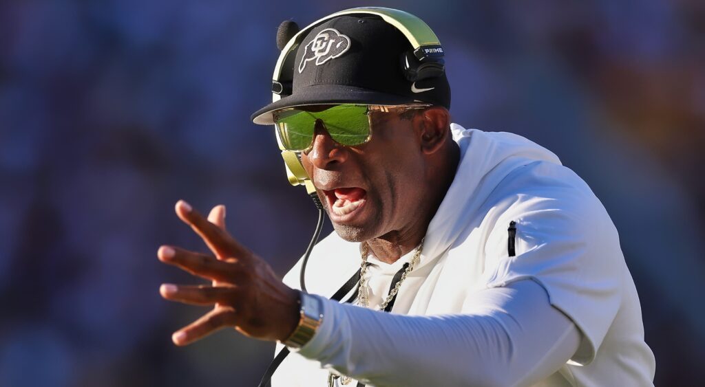Colorado Buffaloes head coach Deion Sanders yells while coaching a game.