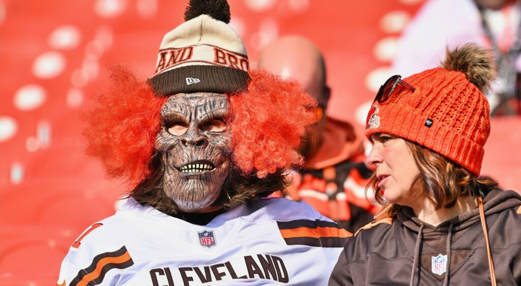 A Cleveland Browns fan with a creepy mask on.