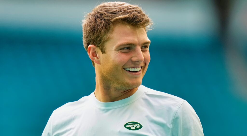 Zach Wilson smiling in Jets shirt