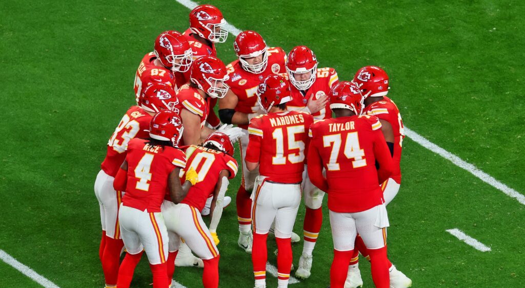 Kansas City Chiefs players in huddle