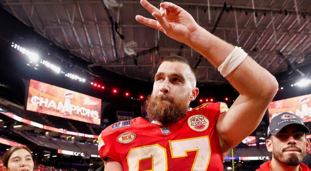 Travis Kelce gives the peace sign after winning the Super Bowl.