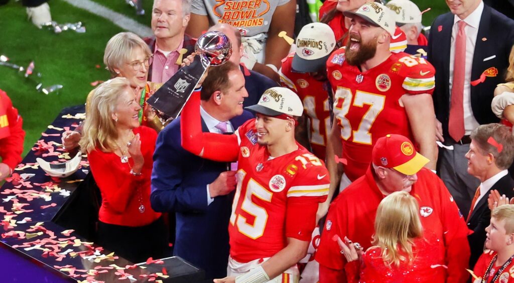 Kansas City Chiefs holding Super Bowl 58 trophy.