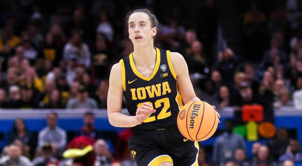 Caitlin Clark of Iowa Hawkeyes dribbling basketball.