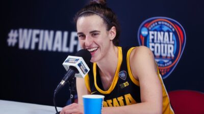 Caitlin Clark smiling at press conference