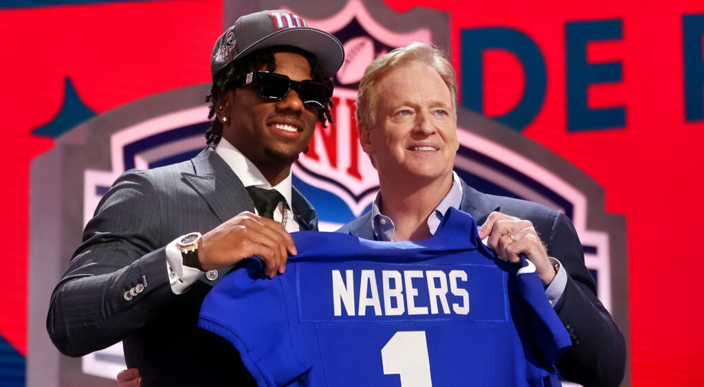 Malik Nabers holding jersey with Roger Goodell