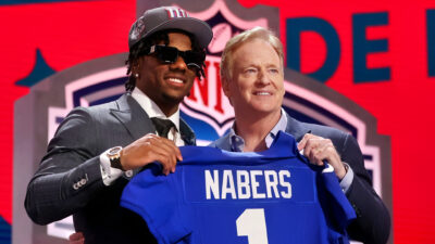 Malik Nabers holding jersey with Roger Goodell