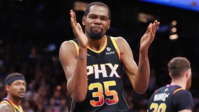 Kevin Durant clapping in Suns jersey