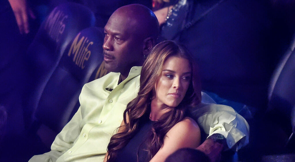 Michael Jordan sitting next to his wife, Yvette Prietto.