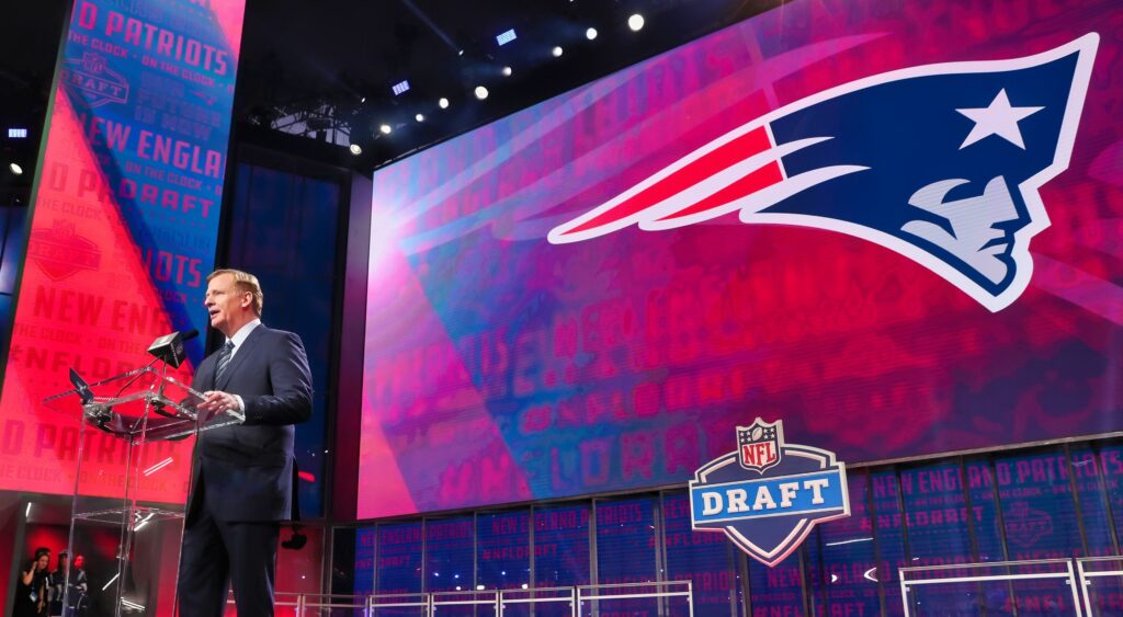 Roger Goodell on stage announcing the New England Patriots' pick at the NFL draft.