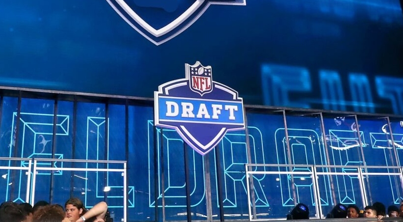 NFL Draft stage and logo.