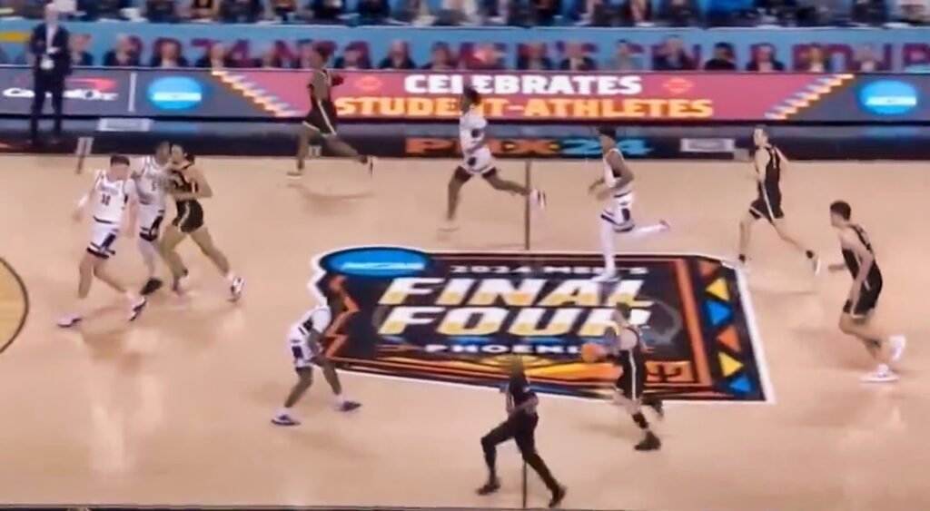 Players run up the court during the 2024 NCAA men's national championship game.
