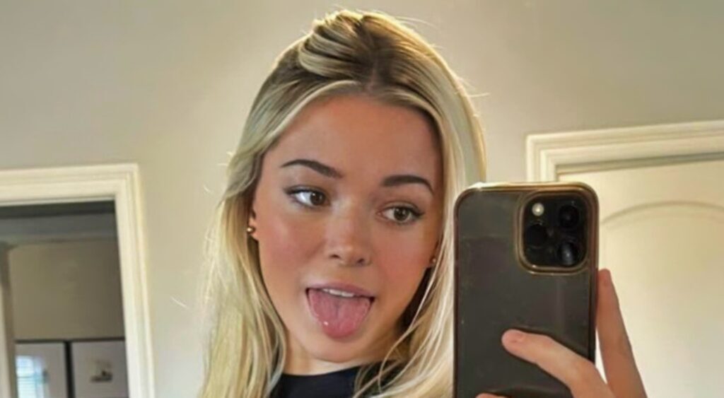 Olivia Dunne taking a selfie with her tongue out.