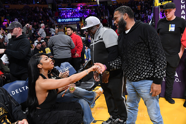 Megan Thee Stallion greeting Anthony Anderson and Cedric the Entertainer