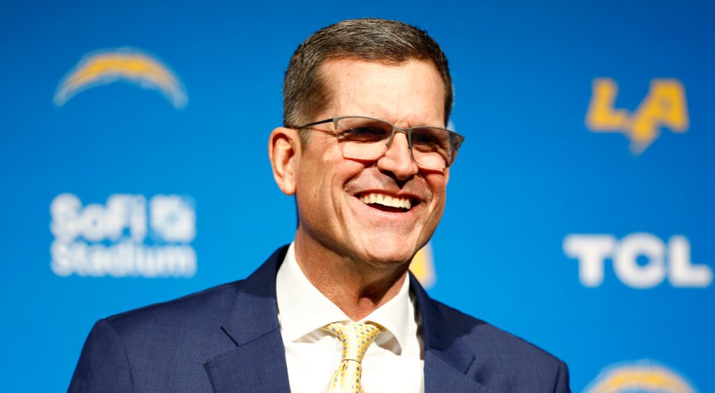 Jim Harbaugh smiling during press conference