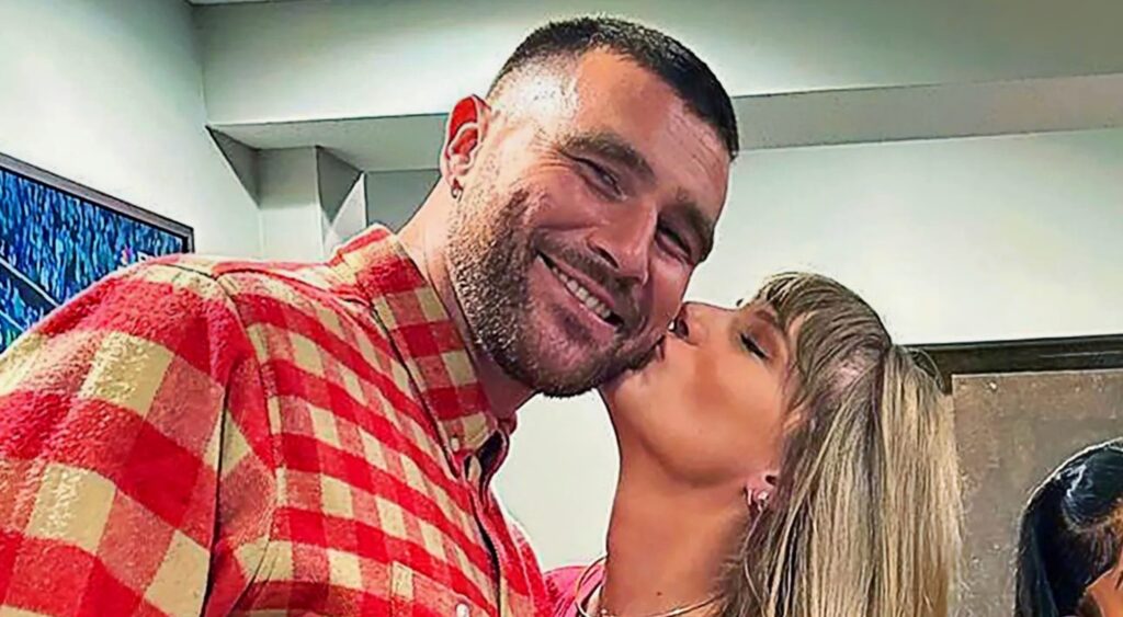 Travis Kelce and Taylor Swift embracing each other