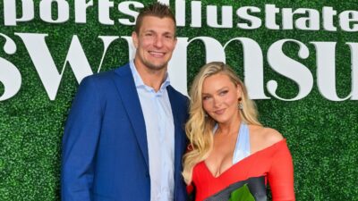 Rob Gronkowski and Camille Kostek posing at event