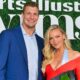 Rob Gronkowski and Camille Kostek posing at event