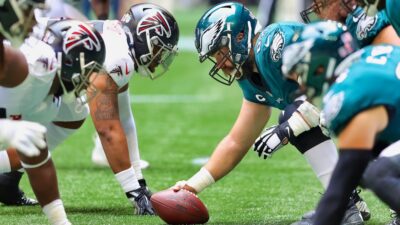 Atlanta Falcons and Philadelphia Eagles players at line of scrimmage