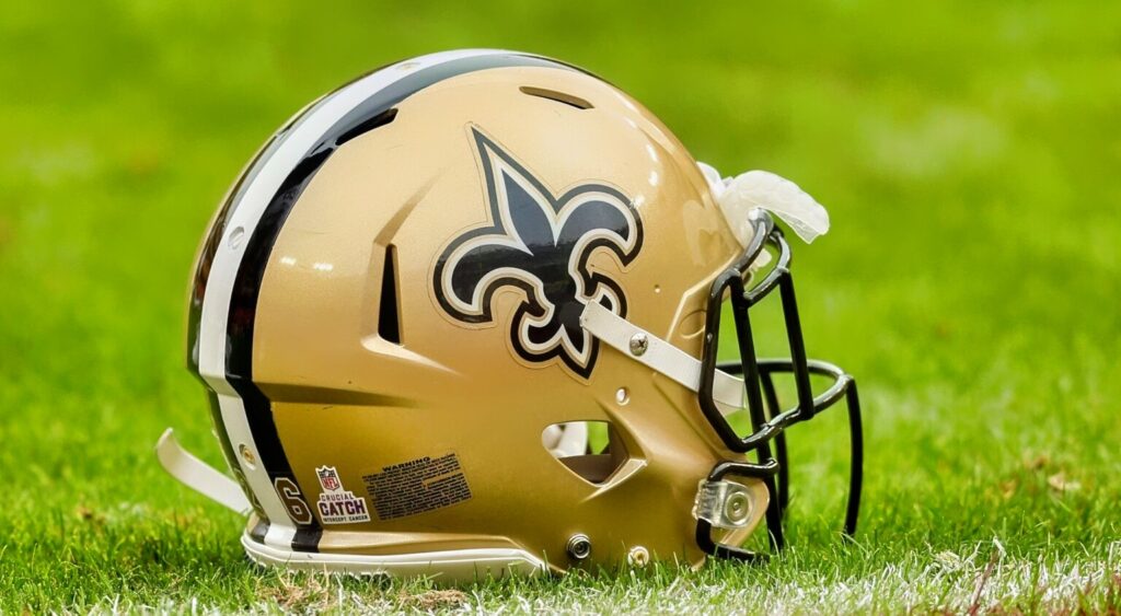 New Orleans Saints helmet shown on field.